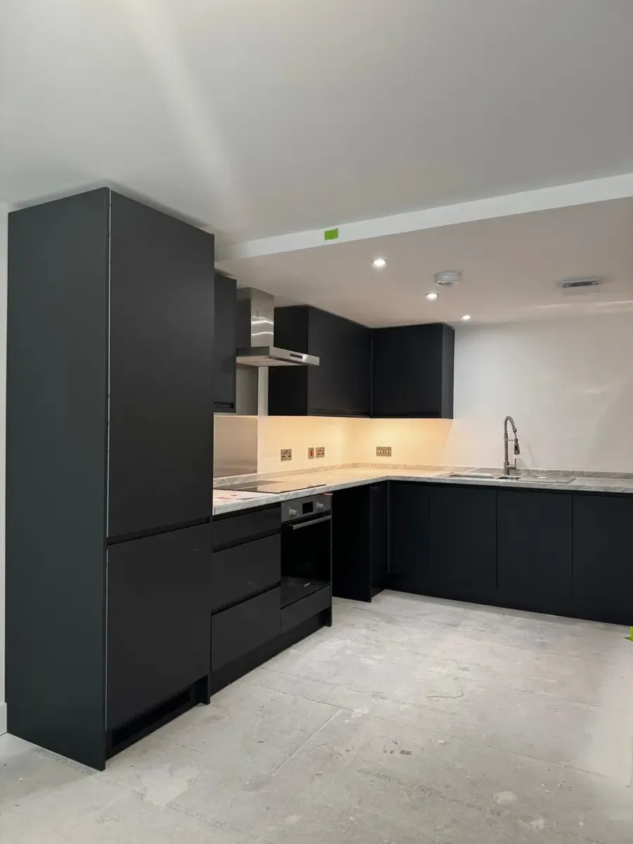 Kitchen sink area with modern fixtures and window Norwich flats