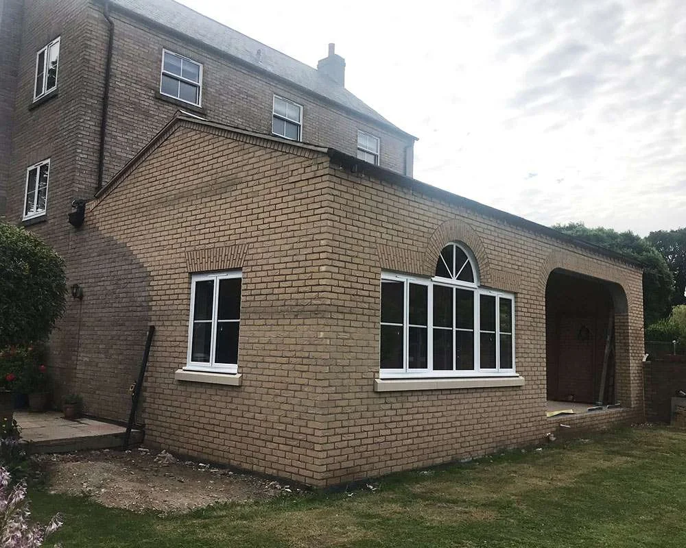 Two-storey side extension with matching brickwork built by Young's Construction in Wymondham