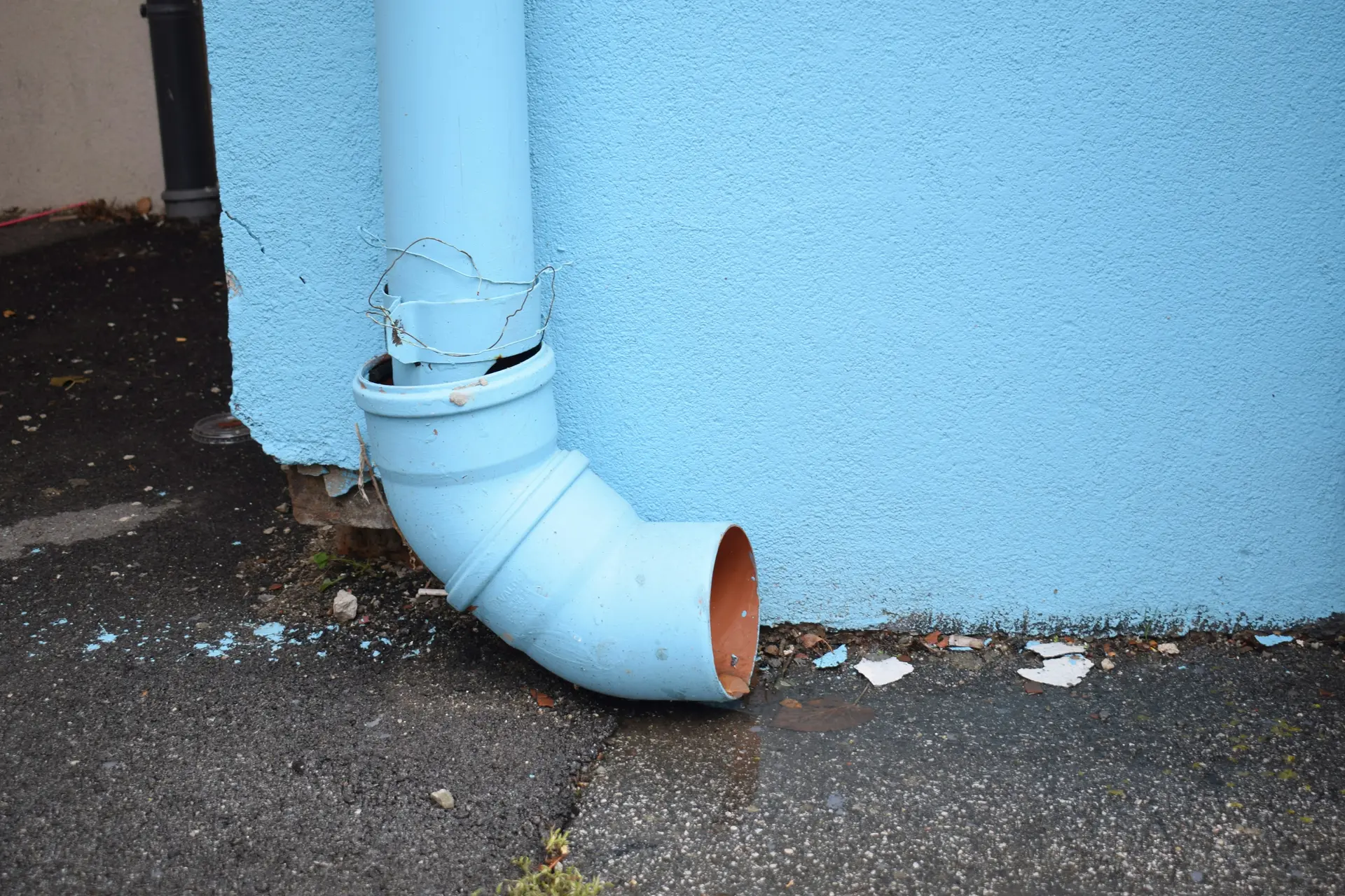 Underground drainage pipe installation with correct fall gradient on a Norfolk construction site